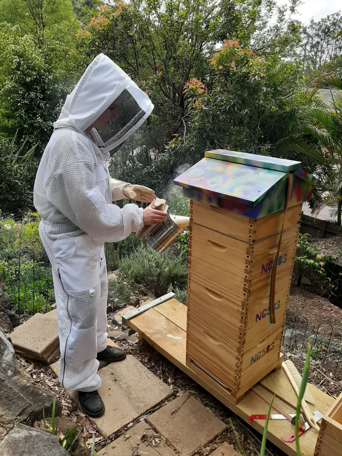 Wendy in her garden tending to her bee hive. She shows how counselling helps relationships